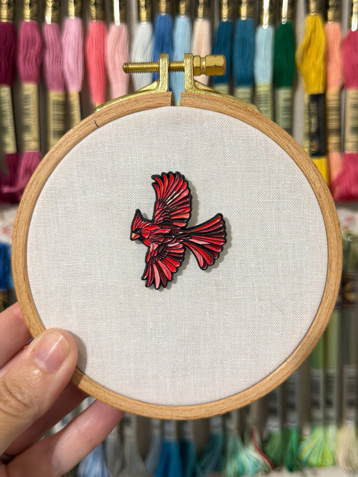 Stained glass cardinal soft enamel needle minder on a 100mm embroidery hoop