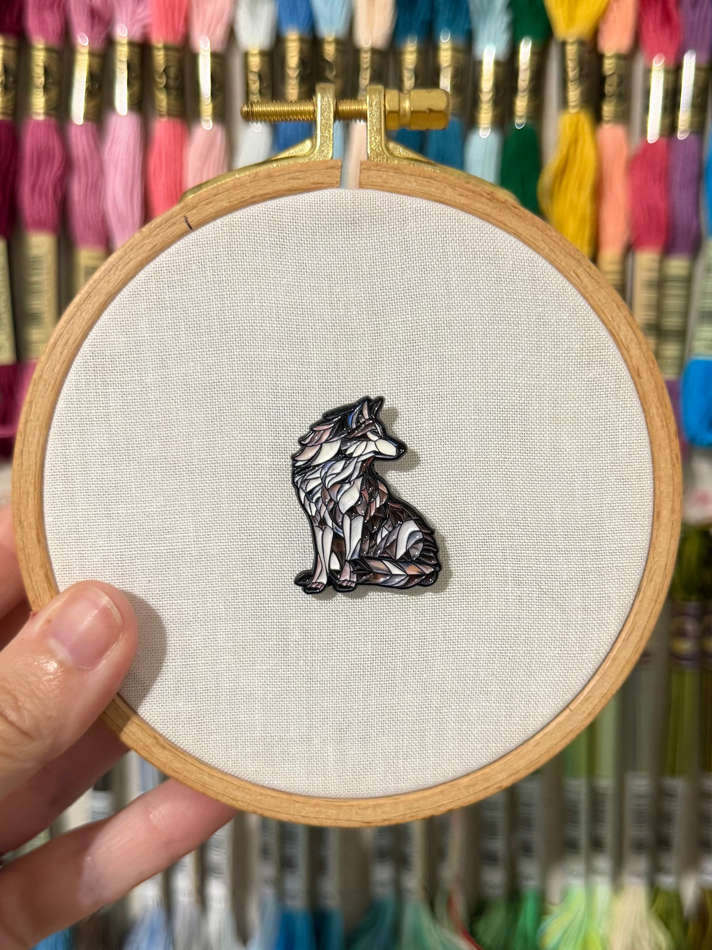 Stained glass wolf soft enamel needle minder on a 100mm embroidery hoop
